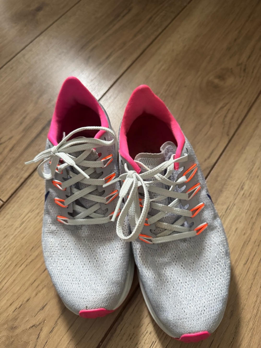 Nike Women's Light Gray Knit Running Shoes with Pink and Orange Accents